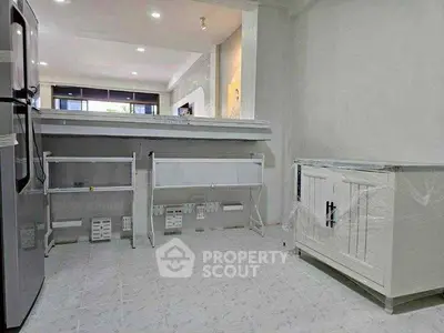 Modern kitchen with sleek appliances and ample storage space