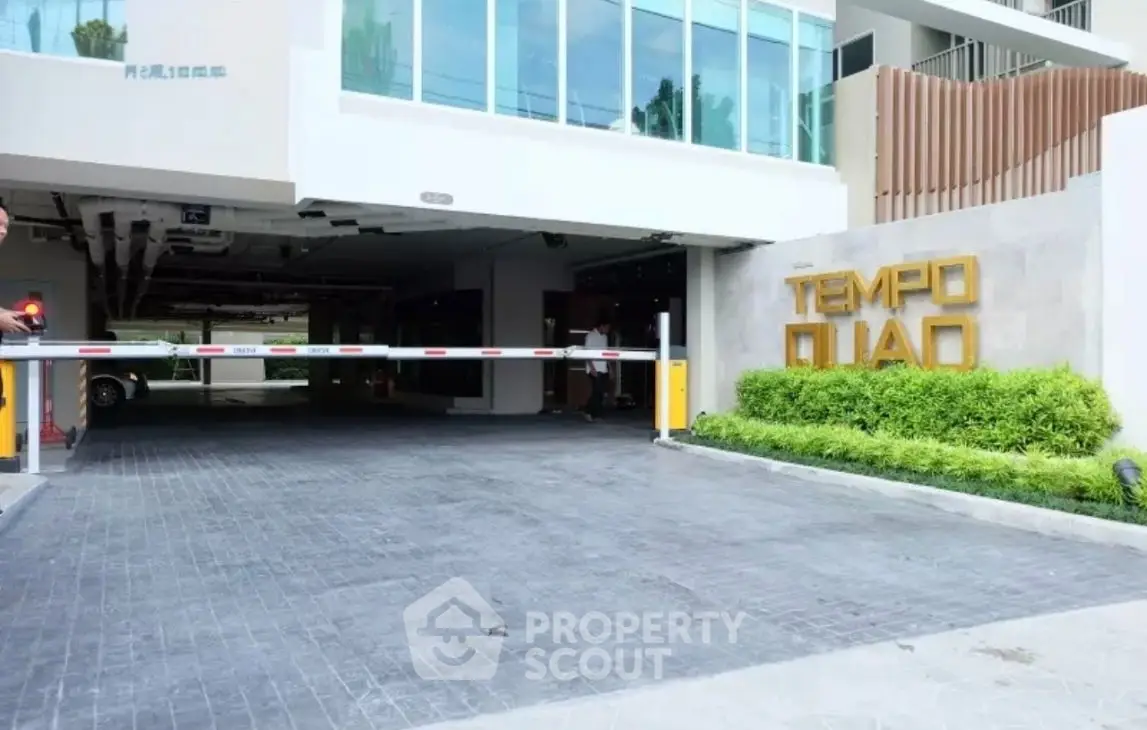 Modern building entrance with secure parking and stylish design