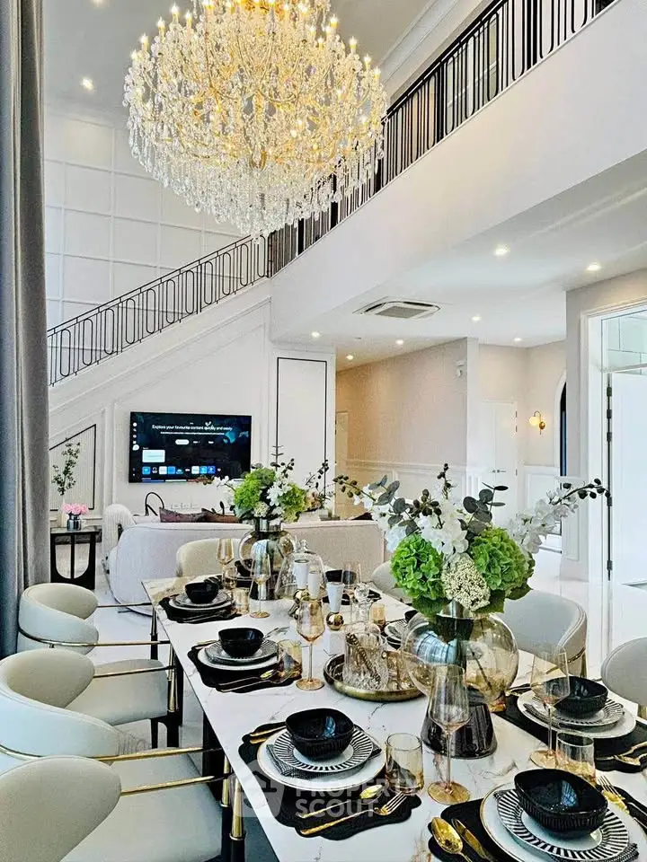 Luxurious dining room with elegant chandelier and modern decor, perfect for upscale entertaining.