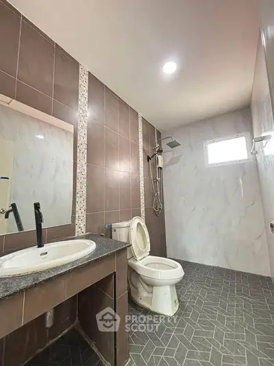 Modern bathroom with sleek tiles and contemporary fixtures