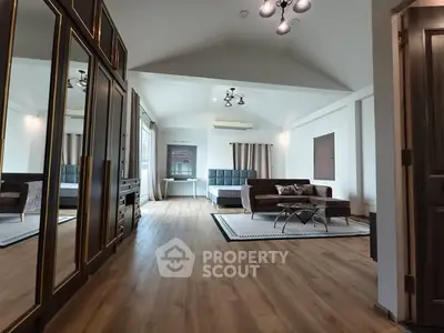 Spacious modern living room with elegant decor and wooden flooring