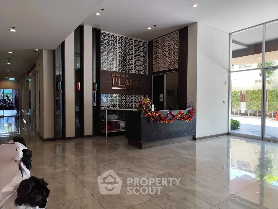 Luxurious building entrance with elegant decor and festive accents