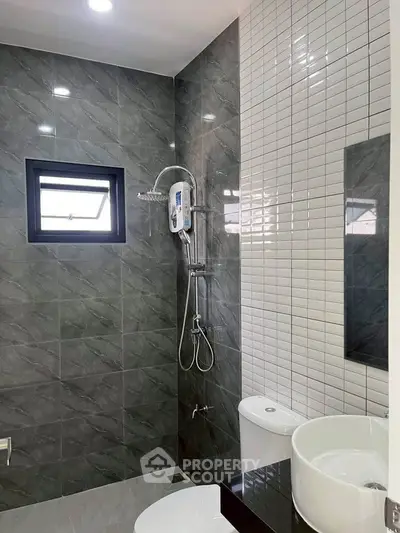 Modern bathroom with sleek tiles and contemporary fixtures