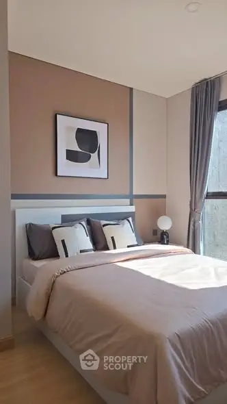 Modern bedroom with stylish decor and natural light