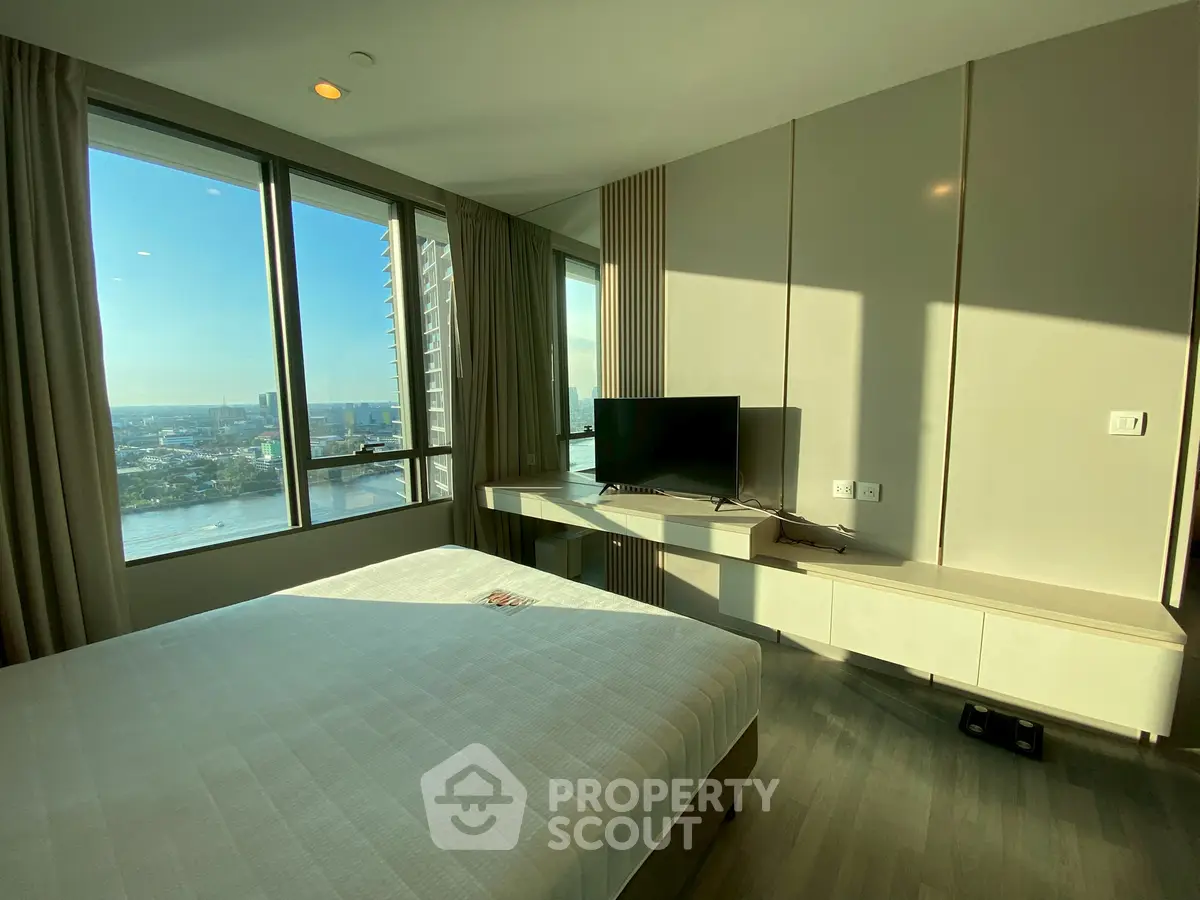 Modern bedroom with stunning city view and sleek furnishings