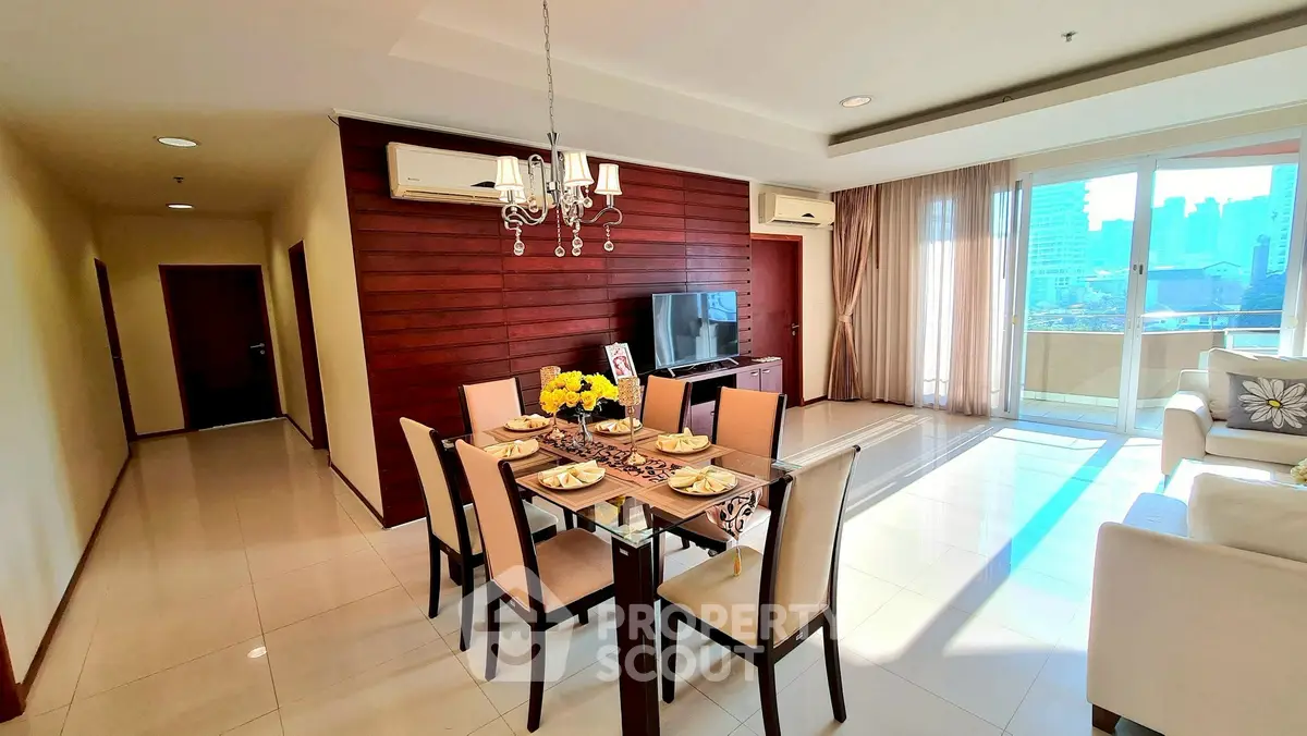 Spacious modern living room with dining area and balcony view in luxury apartment