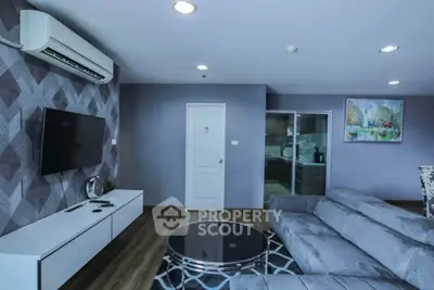 Modern living room with sleek furniture and stylish decor in a contemporary apartment.