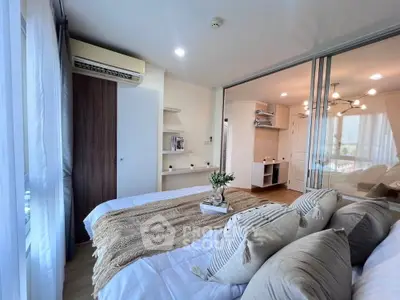 Modern bedroom with stylish decor and ample natural light