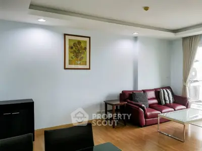 Spacious living room with modern decor and natural light