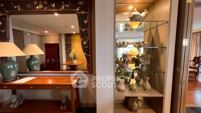 Elegant living room with decorative shelves and stylish mirror