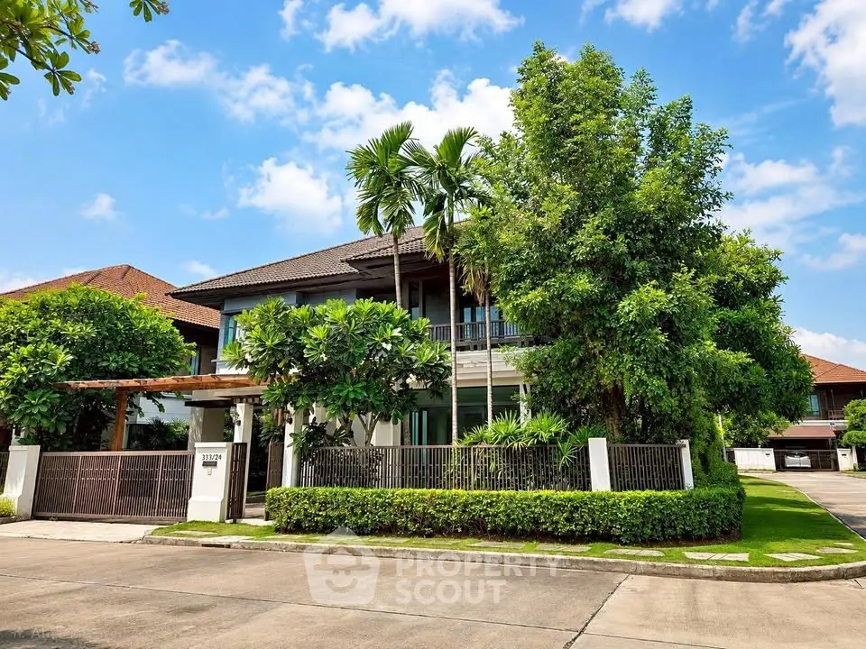 Stunning modern house with lush greenery and spacious driveway in a serene neighborhood.