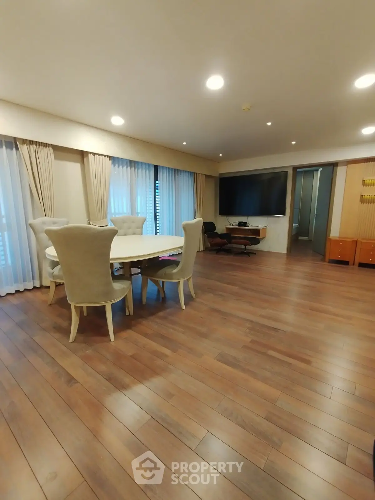 Spacious living room with elegant dining area and modern decor