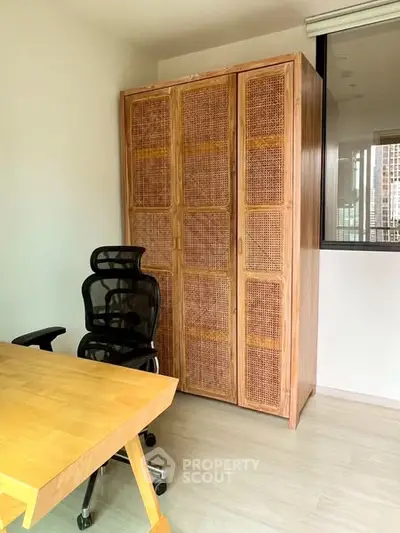 Modern study room with wooden desk and ergonomic chair