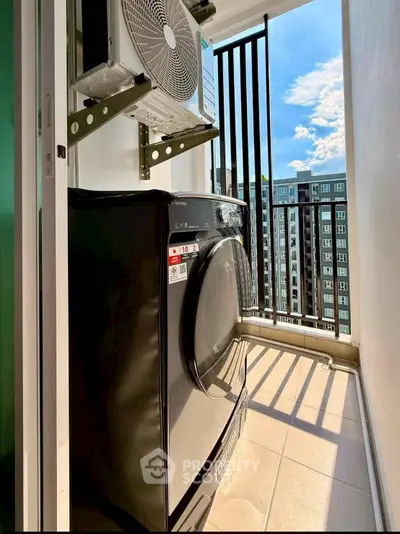 Modern apartment balcony with washing machine and city view, perfect for urban living.