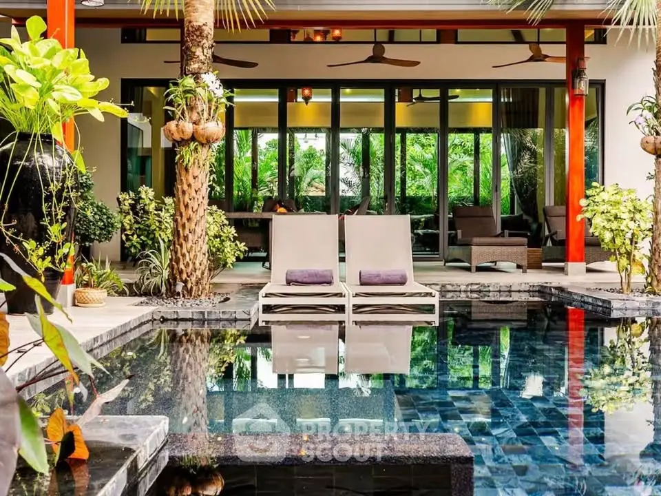 Luxurious tropical villa with private pool and lush garden, perfect for relaxation and entertaining.