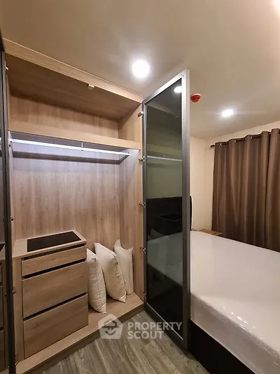 Modern bedroom with built-in wardrobe and cozy lighting