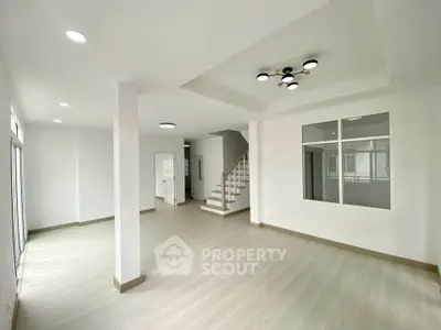 Spacious modern living room with elegant lighting and open layout