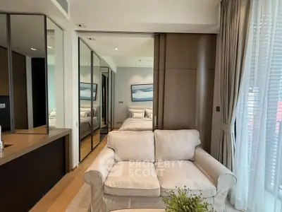 Modern living room with elegant decor and large windows for natural light