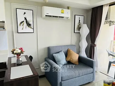 Chic modern living room with stylish decor and cozy seating in a bright apartment.
