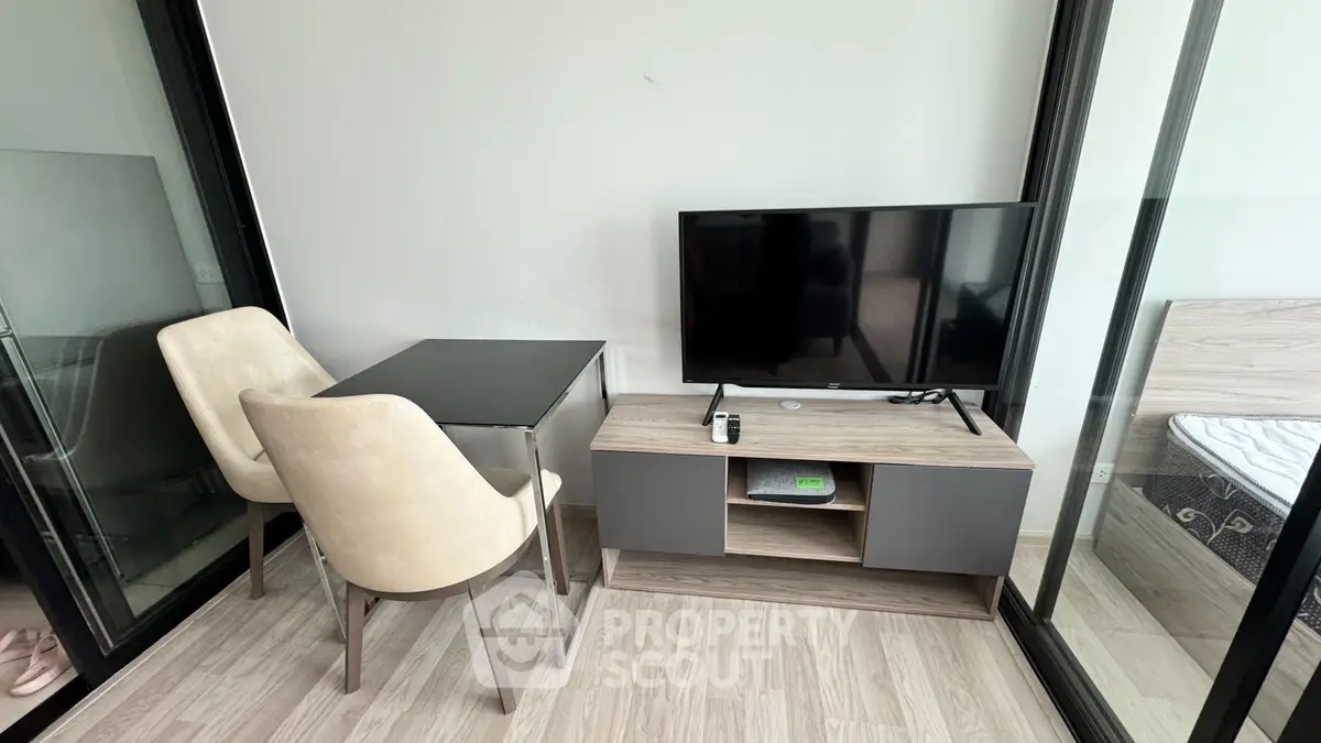 Modern living room with sleek TV stand and cozy seating