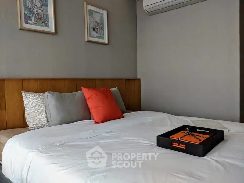 Cozy bedroom with modern decor and air conditioning unit