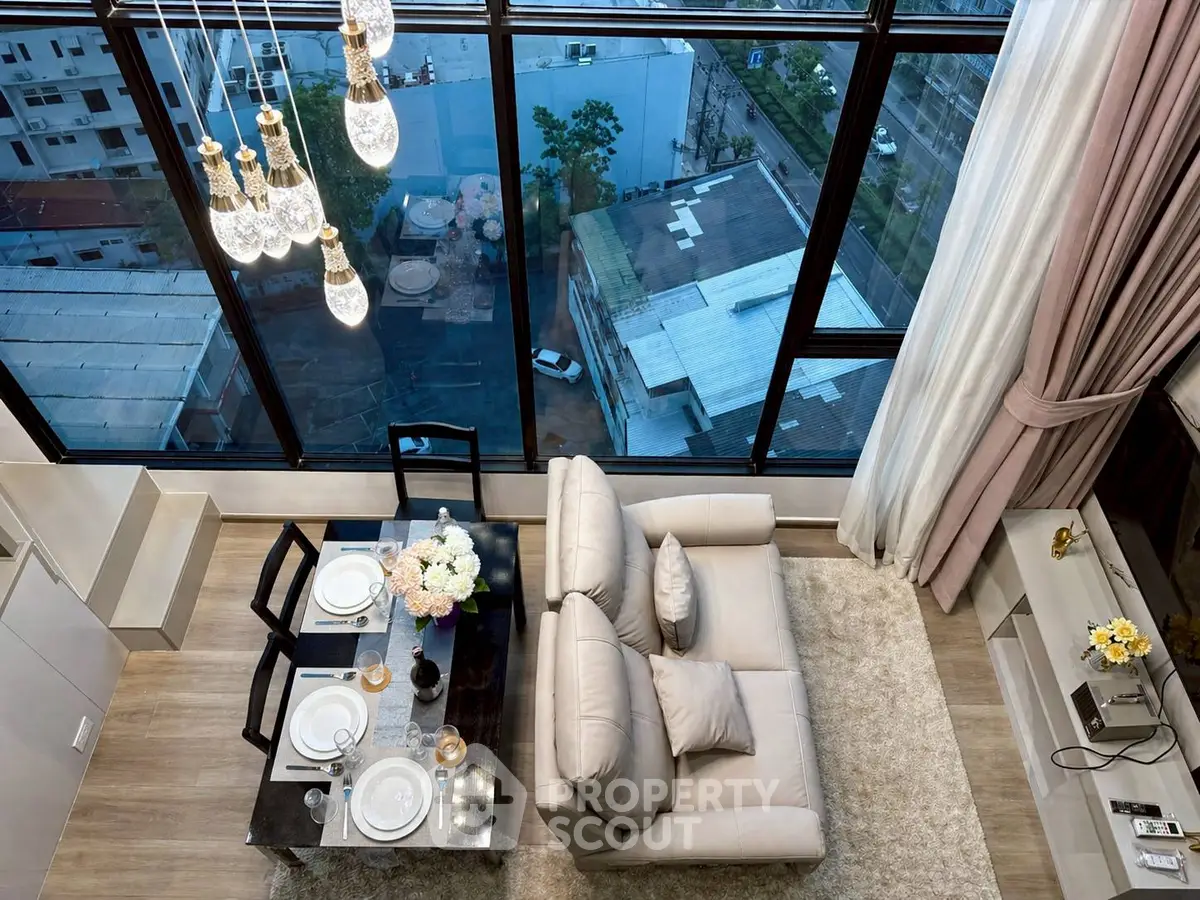 Luxurious high-rise living room with floor-to-ceiling windows and elegant dining area.