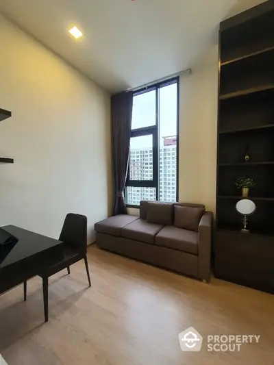 Modern living room with high ceiling and large window in urban apartment