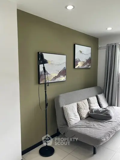 Cozy living room with modern decor and stylish floor lamp, perfect for relaxation.