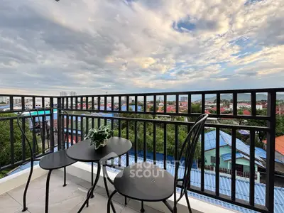 Charming balcony with stunning cityscape views, perfect for relaxation and enjoying the skyline.