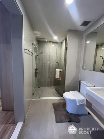 Modern bathroom with glass shower and sleek fixtures