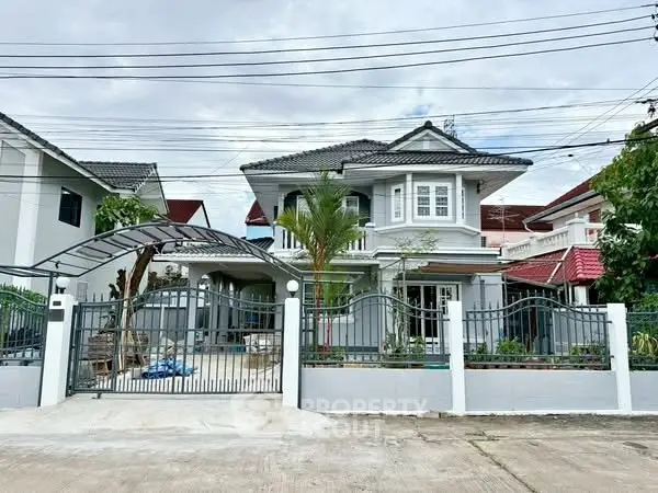 Charming two-story house with modern design and spacious driveway in a serene neighborhood.