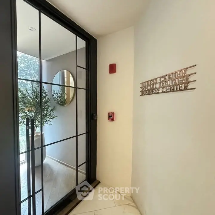 Elegant business center entrance with glass door and modern decor