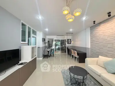 Spacious modern living room with elegant decor and open dining area