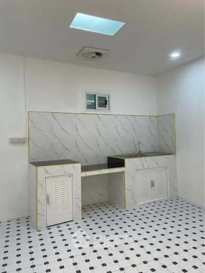 Modern minimalist kitchen with marble backsplash and checkered floor tiles