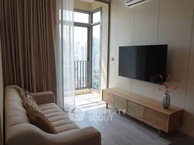 Modern living room with balcony view and sleek TV setup
