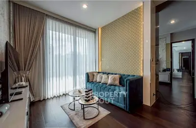 Luxurious living room with elegant decor and large windows for natural light.