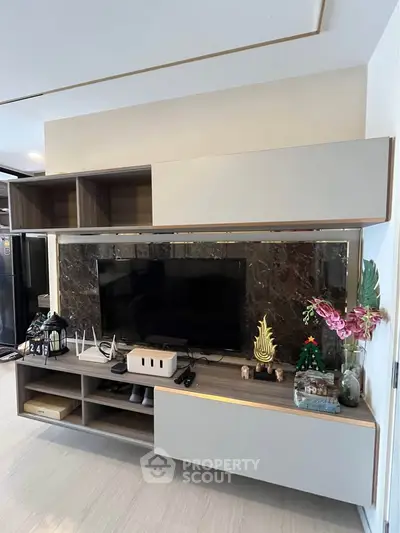 Modern living room with sleek entertainment center and stylish decor