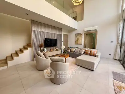 Luxurious modern living room with high ceilings and elegant decor