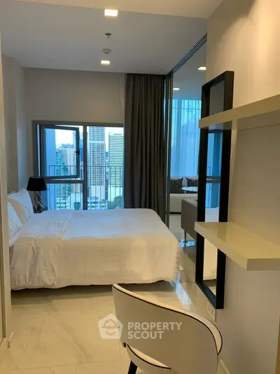 Modern bedroom with city view, featuring sleek design and natural light, perfect for urban living.