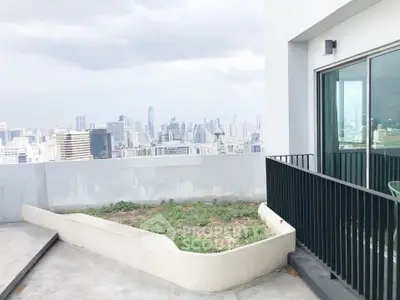 Stunning cityscape view from a modern balcony in a high-rise building.