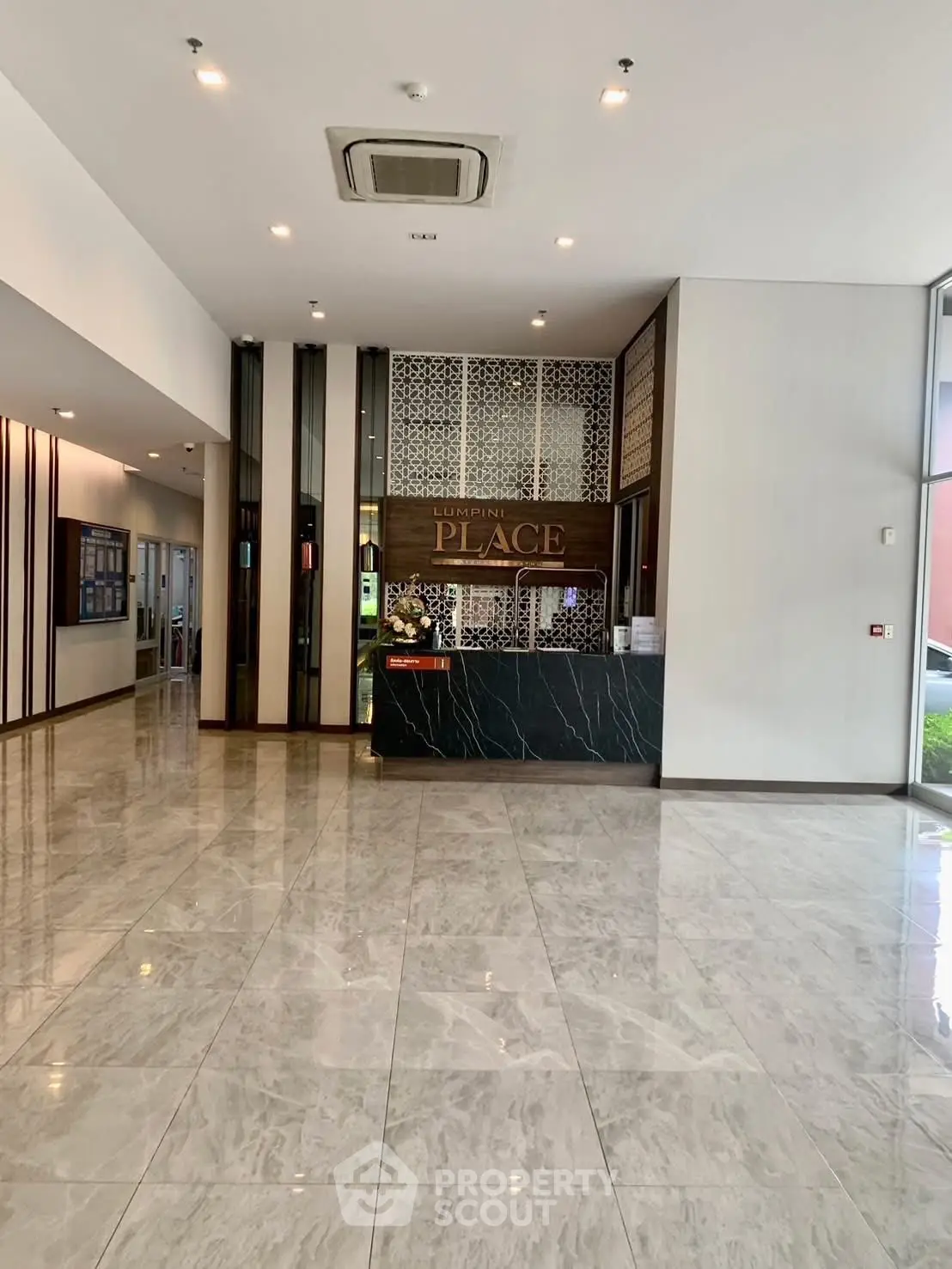 Luxurious building entrance with marble flooring and modern design
