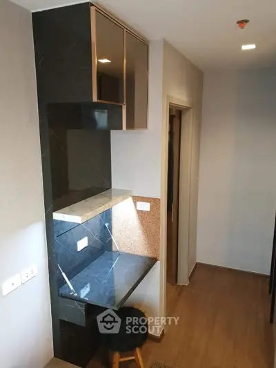 Modern hallway with sleek built-in desk and stylish lighting