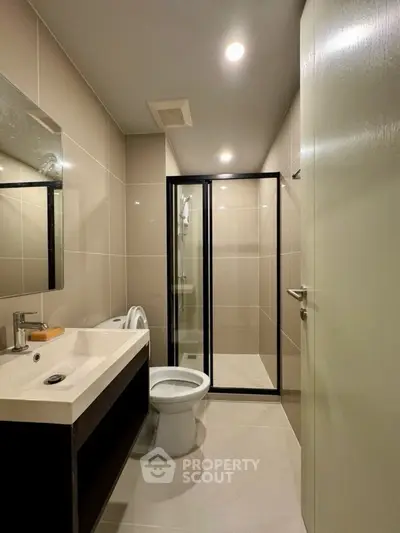 Modern bathroom with sleek design and glass shower enclosure