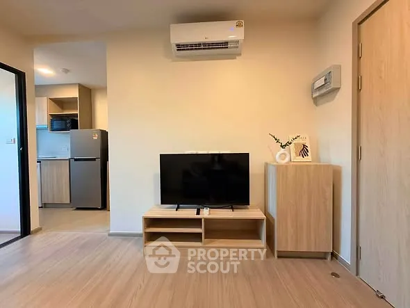 Modern living room with TV and air conditioning in a cozy apartment