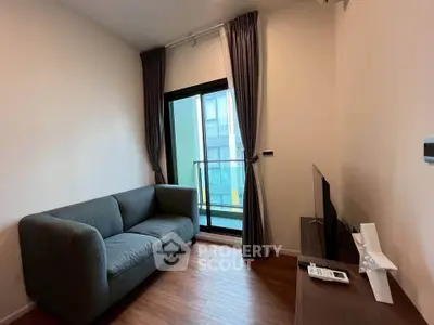 Cozy living room with modern sofa and balcony view in stylish apartment