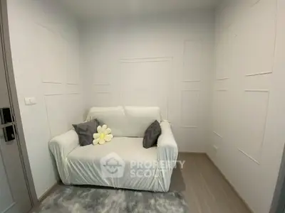 Cozy small living room with white sofa and minimalist decor