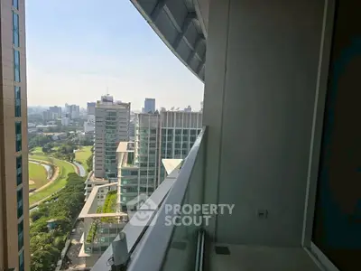 Stunning cityscape view from a modern high-rise balcony, perfect for urban living enthusiasts.
