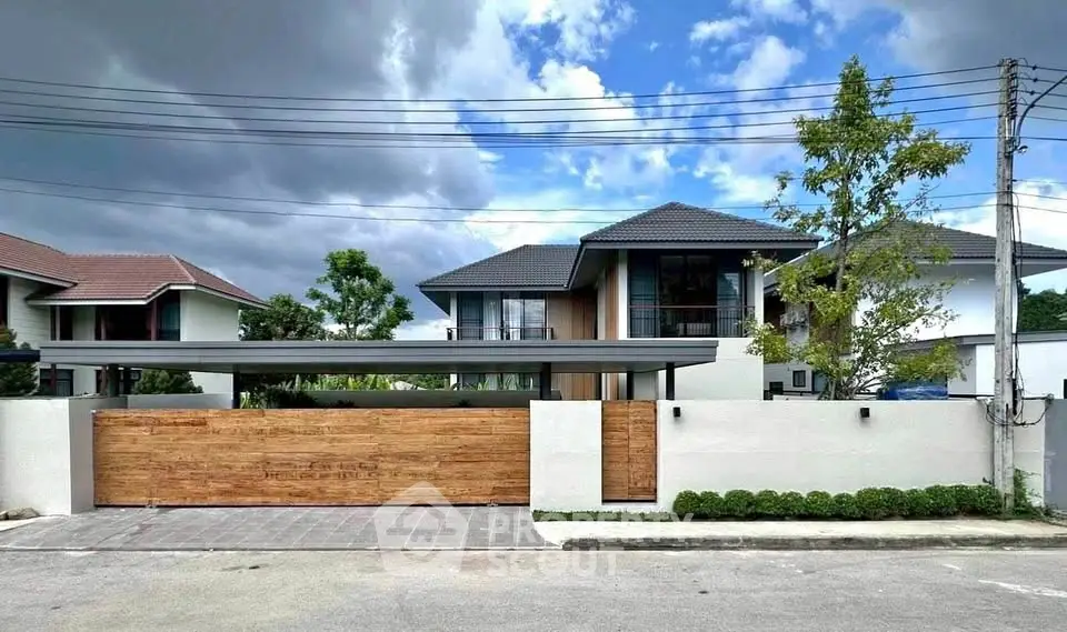 Modern luxury home with sleek design and spacious driveway in a serene neighborhood.