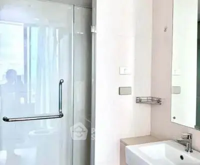 Modern bathroom with glass shower and sleek sink design