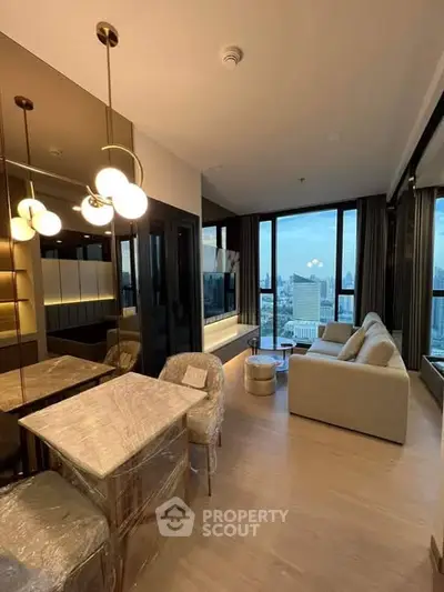 Luxurious modern living room with stunning city view, elegant lighting, and stylish furniture in high-rise apartment.